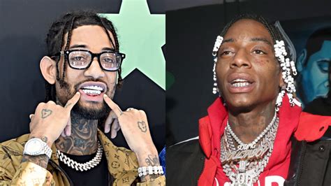 rappers wearing fake watches|rapper wearing diamond necklace.